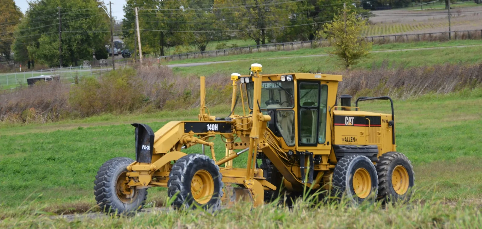Caterpillar motor grader, an example of earthmoving equipment served by the aftermarket parts industry