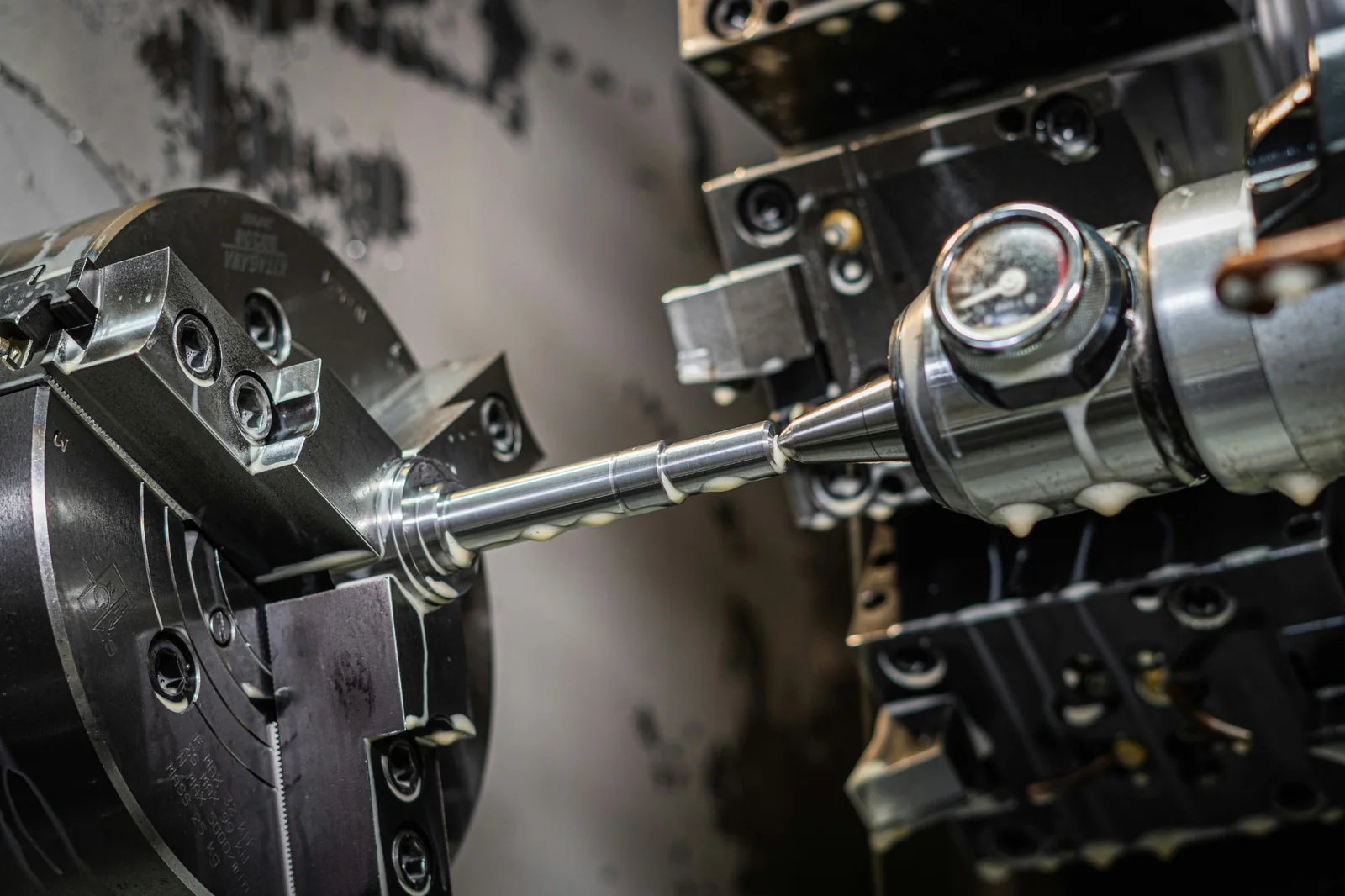 Precision turning process on a metal component, illustrative photography